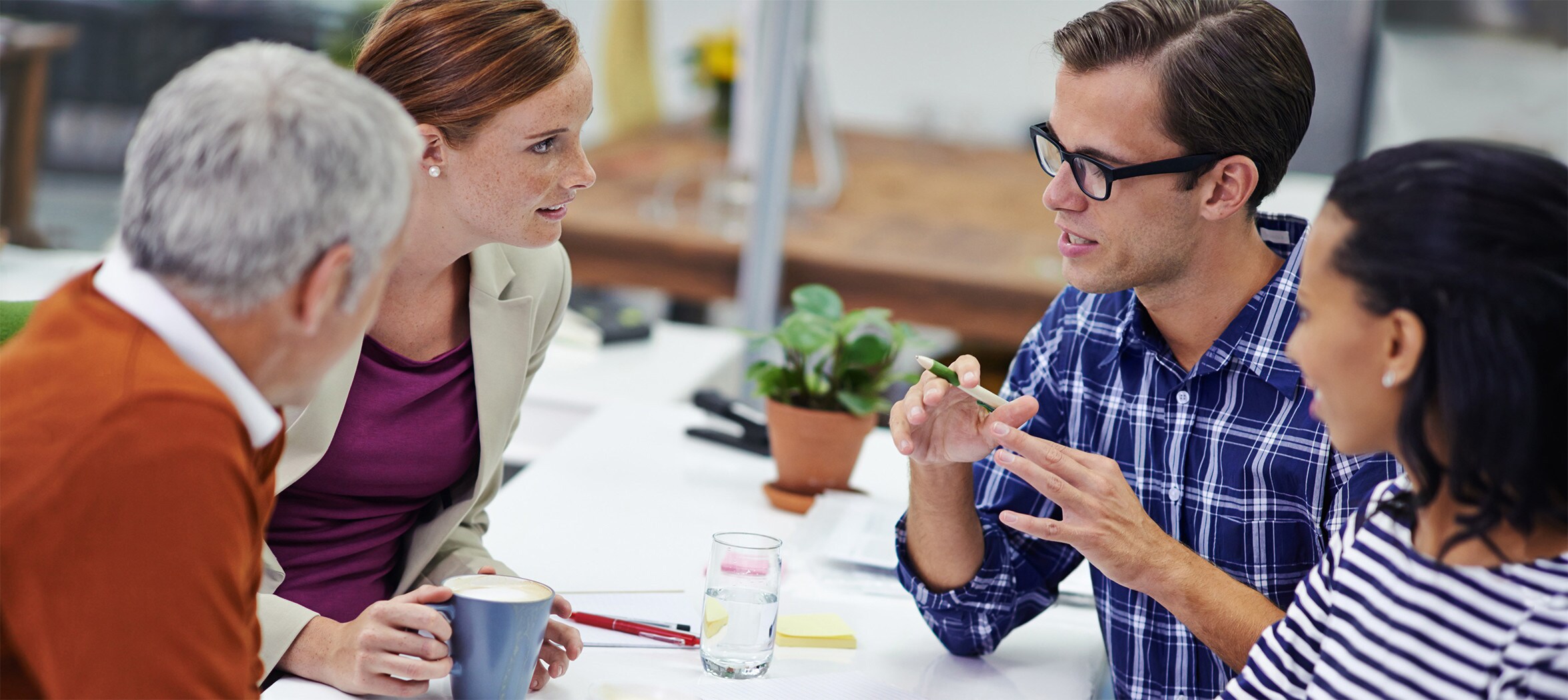 Business people meeting around table in office