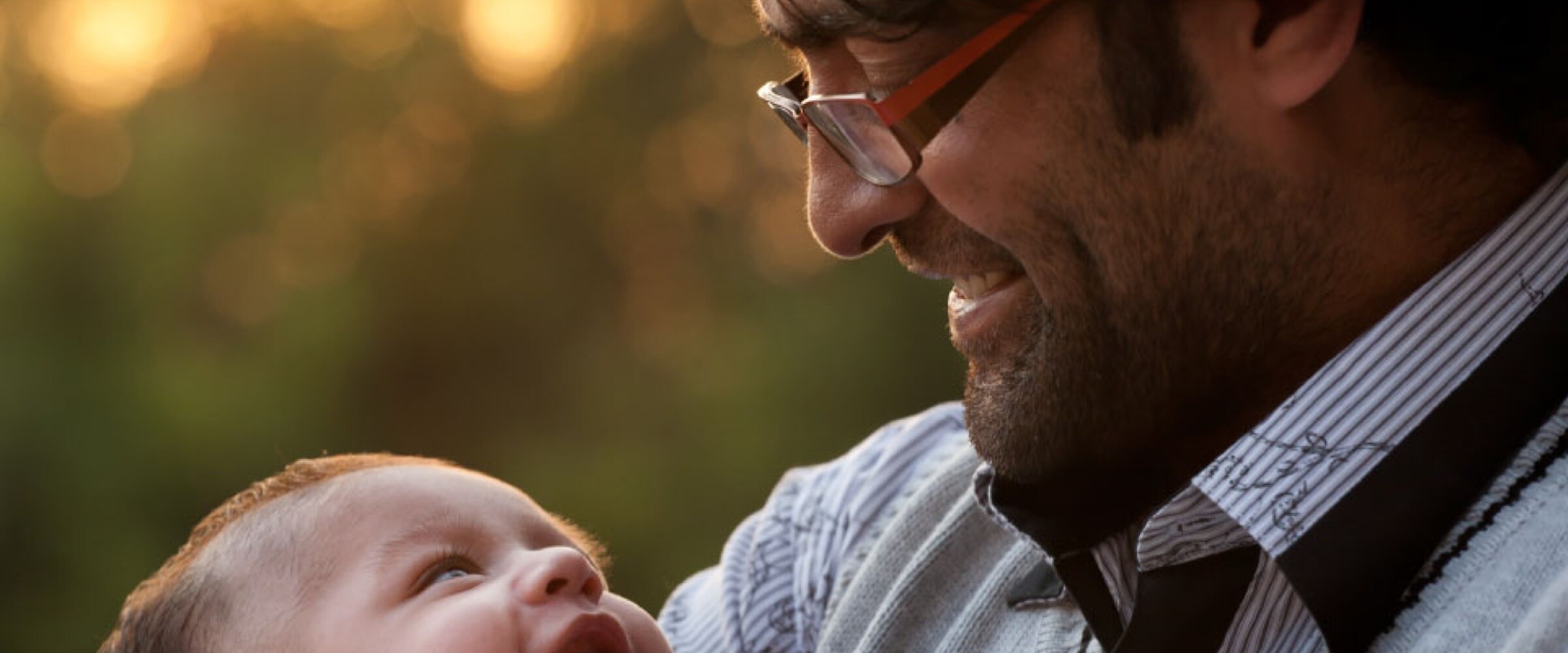 Photo of middle-aged man holding his son.