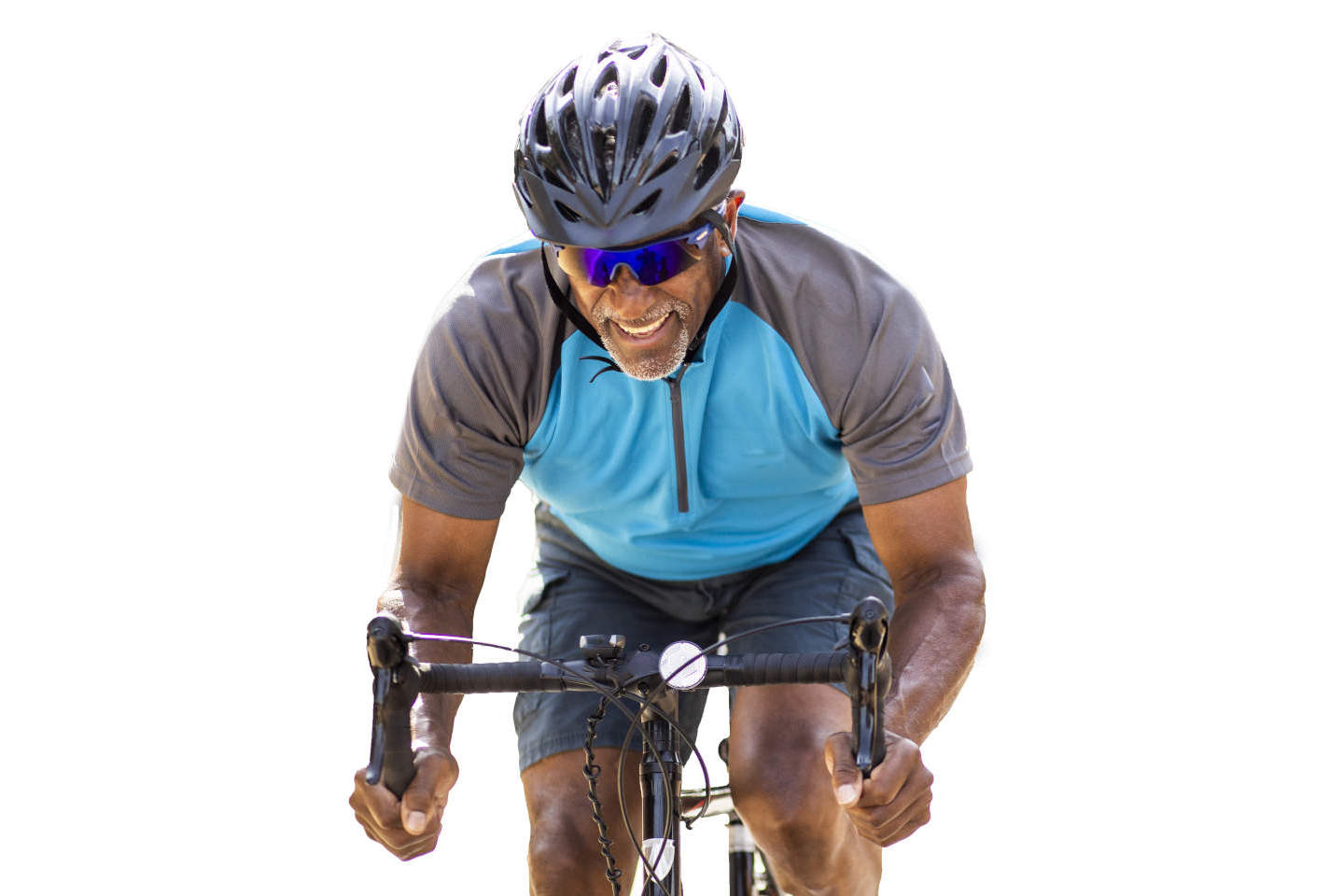 Man on bicycle pedaling hard.